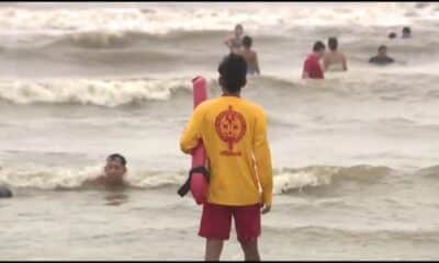 Galveston lifeguard watching swimmers on a yellow flag day